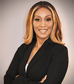 Woman professionally dressed smiling.